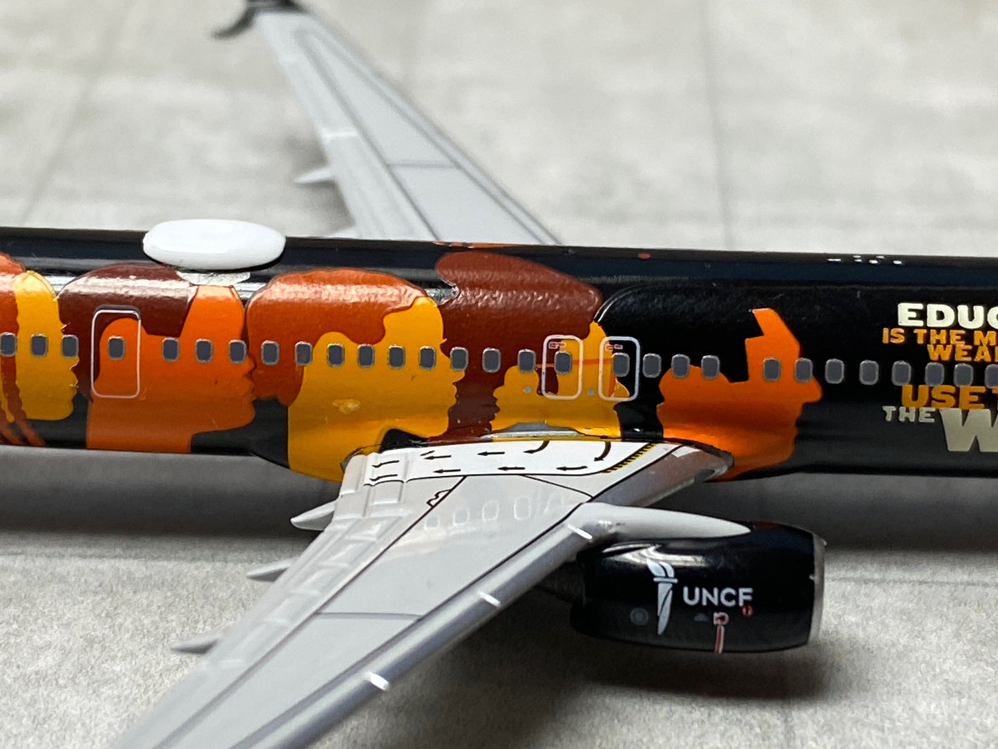 1/400 Alaska Airlines B 737-900ER "UNCF - Education Change the World" NG Models 79003 *Multiple paint chips on fuselage*